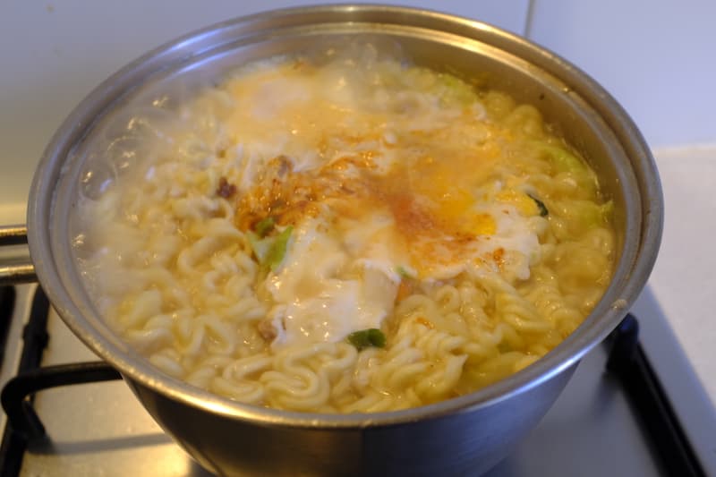 Ramen in pot cooked and ready to drain